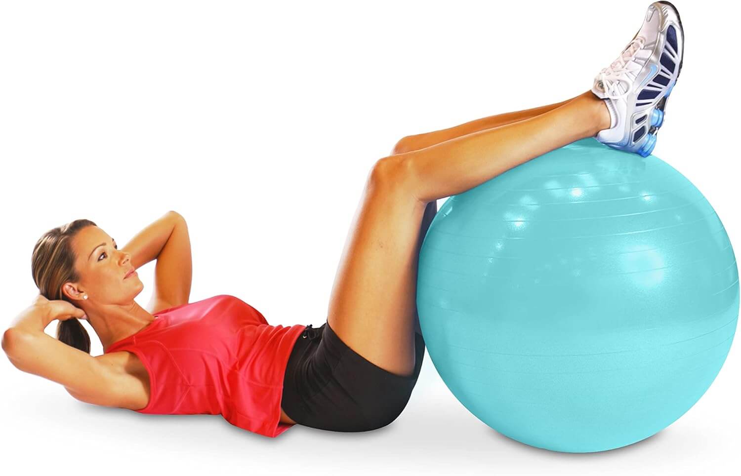 Woman exercising on a Herbionyx Stability Ball for core strength and balance.