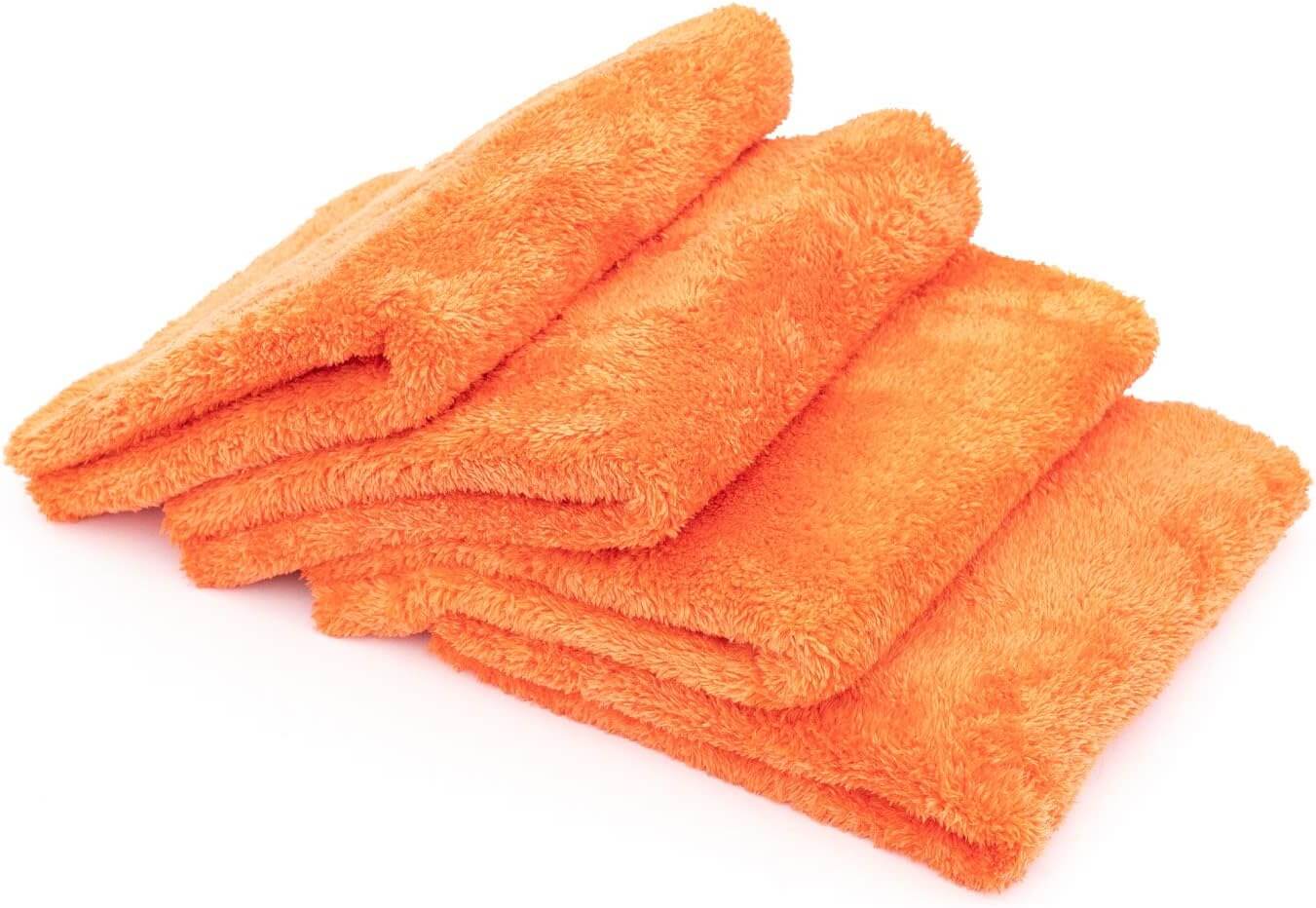 Four vibrant orange Herbionyx UltraSoft Microfiber Towels stacked for polishing and detailing surfaces.